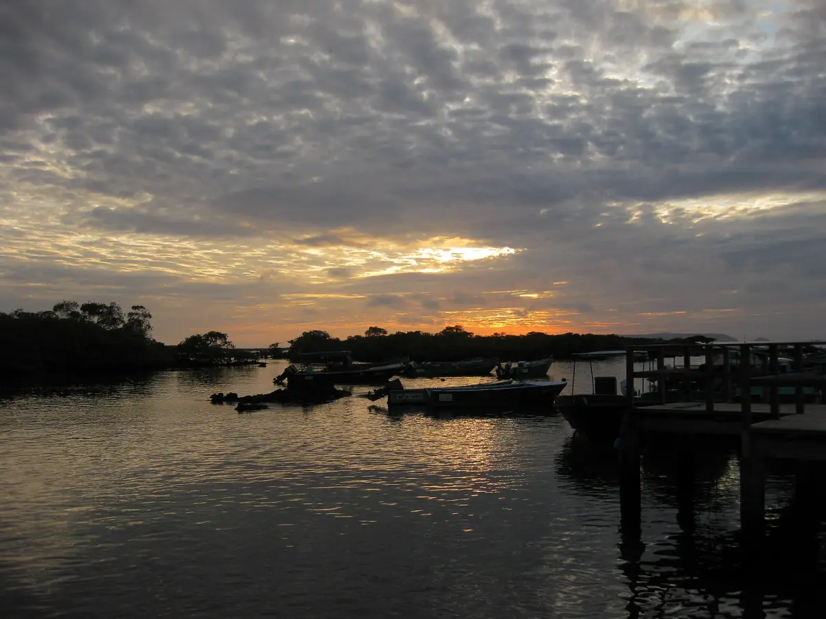 Sunset at a pier in Puerto Villamil